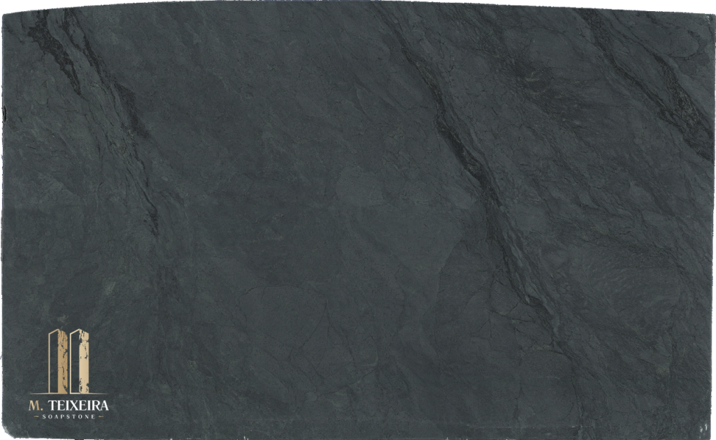 Belvedere Soapstone Lot 7563

Size: 125″ x 75″ x 3cm

Multiple Slabs available.

Product Overview:
Aesthetic Features: Belvedere Soapstone offers a dramatic interplay of deep charcoal tones and striking white veining, making it a favorite among architects and interior designers seeking a bold yet timeless surface material. Quarried in Brazil, this premium soapstone delivers a sophisticated aesthetic that pairs beautifully with both contemporary and classic design palettes.

Renowned for its durability, heat resistance, and low maintenance, Belvedere performs exceptionally in both residential and commercial applications. Its naturally smooth, matte texture develops a subtle patina over time, enhancing its organic appeal and depth.

Applications: Ideal for both indoor and outdoor installations.

Common Uses:

Outdoor Spaces: Perfect for outdoor kitchens, BBQ surrounds, patio bars, poolside counters, garden workstations, beverage stations, fire pit surrounds, buffet stations, backyard prep areas, outdoor sinks, wet bars, rooftop terrace countertops, and pizza oven surrounds.
Indoor Spaces: Excellent for kitchen countertops, bathroom vanities, kitchen islands, laundry room counters, wet bars, tabletops, backsplashes, waterfall edges, and shower surrounds.
Design Style: Classic Black Soapstone

Product Information:
Stain Resistance

Exceptional Resistance: Non-porous surface eliminates the need for sealing.
Scratch Resistance

Good Protection: Harder than average soapstone due to its lower Talc contents.
Heat Resistance

Superior Performance: Handles high temperatures, making it perfect for kitchen use.
Hardness

Harder Than Average Soapstone 
Periodic Maintenance

No Sealing Needed: Non-porous, though periodic oiling is suggested to maintain darker appearance.
Country of Origin

Brazil
Item Weight

Density: 22 lbs per square foot.